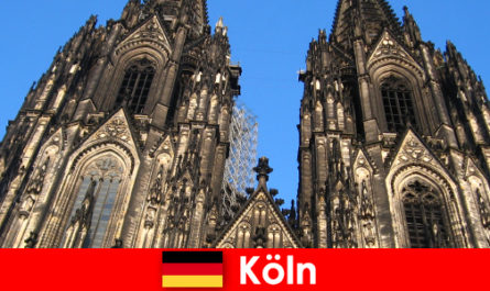 German family vacationers with children like to travel to the city of Cologne