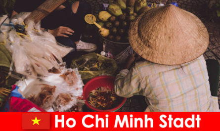 Foreigners try the variety of food stalls in Ho Chi Minh City Vietnam