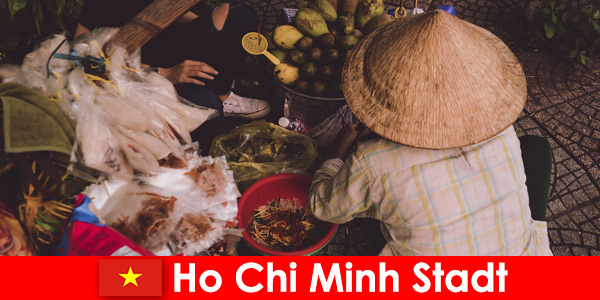 Foreigners try the variety of food stalls in Ho Chi Minh City Vietnam