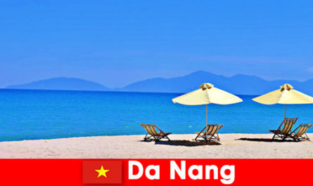 Package tourists relax on the azure blue beaches in Da Nang Vietnam