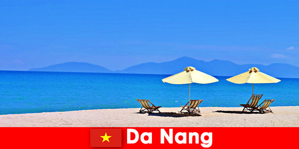 Package tourists relax on the azure blue beaches in Da Nang Vietnam