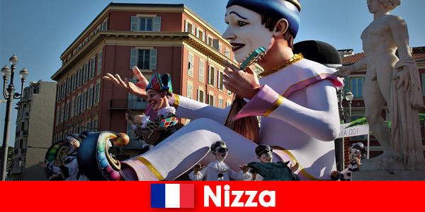 Trip for carnavalists with family to traditional carneval parade in Nice France