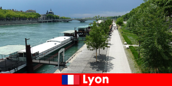 Exploring the city by bike on the riverbank in Lyon France